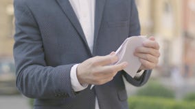 Unrecognizable well-dressed businessman in glasses tearing apart documents. Office lifestyle, business, difficulties in stock video footage Unrecognizable well-dressed businessman in glasses tearing apart documents. Office lifestyle, business, difficulties in stock video footage