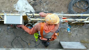 Unrecognizable worker in a suspended scaffold royalty free stock photo Unrecognizable worker in a suspended scaffold royalty free stock photo