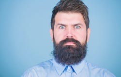 Unshaven and handsome. Caucasian hipster. Bearded man with fashion haircut. Brutal man with long beard hair and mustache stock images Unshaven and handsome. Caucasian hipster. Bearded man with fashion haircut. Brutal man with long beard hair and mustache stock images