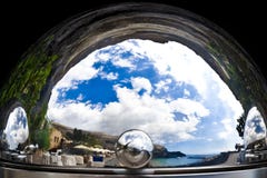 Unseen reality - mediterrean landscape and seashore in a silver cloche