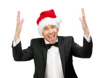 Uomo d'affari che indossa il cappuccio di Santa Claus con le mani su fotografia stock libera da diritti Uomo d'affari che indossa il cappuccio di Santa Claus con le mani su fotografia stock libera da diritti