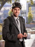 Uomo d'affari che va funzionare in bici Fotografia Stock Uomo d'affari che va funzionare in bici Fotografia Stock