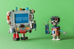 Upgrade computer concept. Handyman technician robot with circuit in hand and monitor robotic character, warning message stock images Upgrade computer concept. Handyman technician robot with circuit in hand and monitor robotic character, warning message stock images