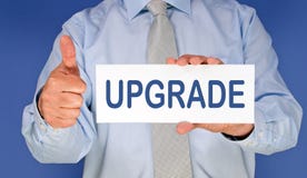 Upgrade - Manager with sign and thumb up Royalty Free Stock Photography Upgrade - Manager with sign and thumb up Royalty Free Stock Photography