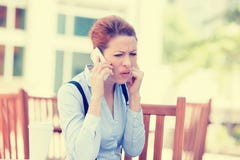 Upset sad skeptical unhappy serious woman talking on phone royalty free stock images Upset sad skeptical unhappy serious woman talking on phone royalty free stock images
