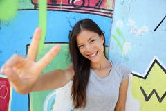 Urban young girl showing v peace sign in city stock photos Urban young girl showing v peace sign in city stock photos