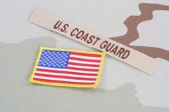 US COAST GUARD branch tape with flag on desert camouflage uniform royalty free stock image US COAST GUARD branch tape with flag on desert camouflage uniform royalty free stock image