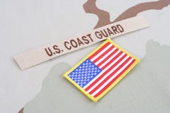 US COAST GUARD branch tape with flag on desert camouflage uniform royalty free stock image US COAST GUARD branch tape with flag on desert camouflage uniform royalty free stock image