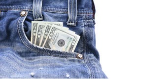 US dollars or money in Blue Denim Jeans Pocket, Concept on earning money, saving money royalty free stock photo US dollars or money in Blue Denim Jeans Pocket, Concept on earning money, saving money royalty free stock photo