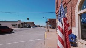 US Flag waving in the wind at Route 66 stock footage US Flag waving in the wind at Route 66 stock footage