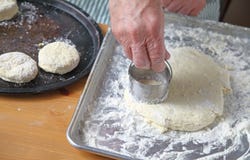 Man makes Southern biscuits, overhead view Stock Photos Man makes Southern biscuits, overhead view Stock Photos