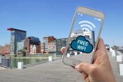 User with smartphone is using free wifi stock images User with smartphone is using free wifi stock images