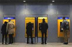 Utrecht, the Netherlands, February 15, 2019: people in front of the ticket machine to pay for their journey with NS stock photography Utrecht, the Netherlands, February 15, 2019: people in front of the ticket machine to pay for their journey with NS stock photography