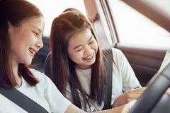 Vacation time and travel, beautiful young women cheerful travels together for a relaxing holiday. And the laughter in the car. stock photography Vacation time and travel, beautiful young women cheerful travels together for a relaxing holiday. And the laughter in the car. stock photography