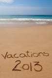 Vacations 2013 written in sand on tropical beach stock photo Vacations 2013 written in sand on tropical beach stock photo