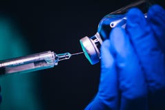 Vaccines and flu shot drug needle syringe on black background. Coronavirus Covid-19 Protection and Vaccine