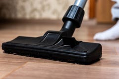 Vacuuming laminate floor. royalty free stock photo Vacuuming laminate floor. royalty free stock photo