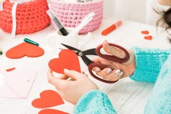 Valentine S Day Theme. Female Hands Cut The Heart Out Of The Pap Royalty Free Stock Photos
