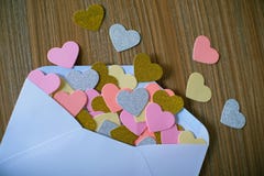 Valentines day love letter. opened envelope and many felt hearts stock images Valentines day love letter. opened envelope and many felt hearts stock images