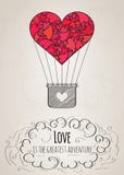 Valentinsgrußkarte mit einem Herz-förmigen Heißluftballon und einem Liebesslogan Lizenzfreie Stockfotografie Valentinsgrußkarte mit einem Herz-förmigen Heißluftballon und einem Liebesslogan Lizenzfreie Stockfotografie