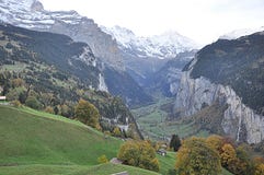 Valley in Switzerland with homes stock photos Valley in Switzerland with homes stock photos