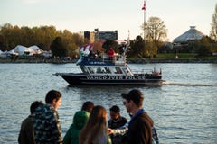 VANCOUVER, BC, CANADA - APR 20, 2019: A Vancouver Police boat patrolling the harbor at the 420 festival in Vancouver. royalty free stock photo VANCOUVER, BC, CANADA - APR 20, 2019: A Vancouver Police boat patrolling the harbor at the 420 festival in Vancouver. royalty free stock photo