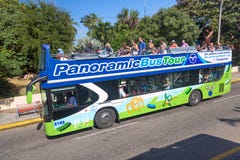 Varadero, Cuba - November, 2018: Varadero green beach tour bus in Cuba. Red and green panoramic buses for tourists ride around the royalty free stock photo Varadero, Cuba - November, 2018: Varadero green beach tour bus in Cuba. Red and green panoramic buses for tourists ride around the royalty free stock photo