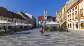 Varazdin/ Croatia-September 12th, 2020: Beautiful girl walking around Varazdin town centre during hot, summer day with almost no