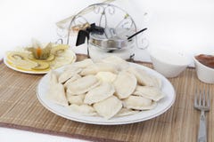 Vareniki with cottage cheese for tea. A perfect addition to the vareniki will be sour cream and a cool sweet jam. stock image Vareniki with cottage cheese for tea. A perfect addition to the vareniki will be sour cream and a cool sweet jam. stock image
