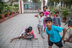 Vari village, Maharashtra, India -January 9, 2018: lovely kinds and their cottages. Daily life in Indian villages near Godavari ri royalty free stock image Vari village, Maharashtra, India -January 9, 2018: lovely kinds and their cottages. Daily life in Indian villages near Godavari ri royalty free stock image