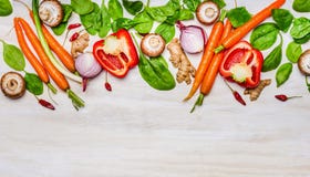 Variety of vegetables ingredients for healthy eating and cooking on white wooden background, top view royalty free stock photo Variety of vegetables ingredients for healthy eating and cooking on white wooden background, top view royalty free stock photo