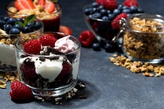 Various Desserts With Fresh Berries And Cream On Dark Background Royalty Free Stock Image