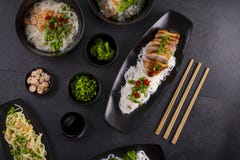 Various Dishes Of Asian Cuisine With Different Types Noodles And Rice With Shrimp, Duck, Vegetables And Black Sesame Stock Images