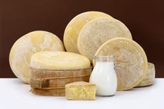 Various Hard Parmesan Cheese On The White Table With Milk Royalty Free Stock Photo