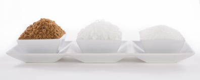 Various Kinds Of Sugar On White Background Stock Photo