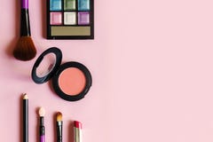 Various makeup products and cosmetics on pink stock photos Various makeup products and cosmetics on pink stock photos