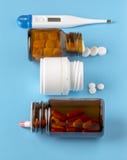 Various pills bottles and white round pills Royalty Free Stock Photos Various pills bottles and white round pills Royalty Free Stock Photos