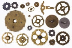 Vecchi denti del movimento a orologeria e parti dell'orologio - isolate immagine stock libera da diritti Vecchi denti del movimento a orologeria e parti dell'orologio - isolate immagine stock libera da diritti