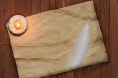 Vecchia carta pergamena con una spoletta e candela, tema medievale con immagine stock Vecchia carta pergamena con una spoletta e candela, tema medievale con immagine stock