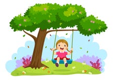 Happy child girl laughing and swinging on a swing under the tree
