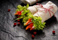 Vegan tortilla wraps stuffed with hummus and fresh vegetables Stock Photos Vegan tortilla wraps stuffed with hummus and fresh vegetables Stock Photos