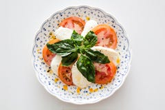 Vegetable Salad on White and Blue Round Floral Plate Stock Image Vegetable Salad on White and Blue Round Floral Plate Stock Image