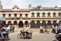 Vehicles on busy Indian street with pedestrians, bikes and cars in Karnataka state Stock Photos Vehicles on busy Indian street with pedestrians, bikes and cars in Karnataka state Stock Photos