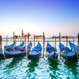 Venice sunset, gondolas or gondole and church on background. Italy stock images Venice sunset, gondolas or gondole and church on background. Italy stock images