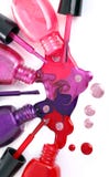 Vernis à ongles coloré débordant des bouteilles photographie stock Vernis à ongles coloré débordant des bouteilles photographie stock