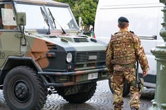 Soldier in camouflage, rear view stock photo Soldier in camouflage, rear view stock photo