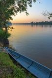 Canoe along the Napo River at Sunset, Ecuador stock images Canoe along the Napo River at Sunset, Ecuador stock images