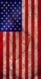 Vertical shot of an American flag on a textured rock background