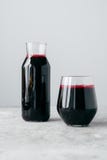 Vertical shot of fresh beetroot drink full of vitamins, in glass bottle, isolated over white background. Healthy drinking. stock photo Vertical shot of fresh beetroot drink full of vitamins, in glass bottle, isolated over white background. Healthy drinking. stock photo