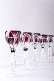 Vertical shot of set of empty glasses for liqueur.Empty space above for text royalty free stock photo Vertical shot of set of empty glasses for liqueur.Empty space above for text royalty free stock photo